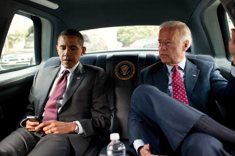 President Barack Obama and Vice President Joe Biden ride in the motorcade from the White House to the Ronald Reagan Building in Washington, D.C., July 21, 2010, to sign the Dodd-Frank Wall Street Reform and Consumer Protection Act.  (Official White House Photo by Pete Souza) This official White House photograph is being made available only for publication by news organizations and/or for personal use printing by the subject(s) of the photograph. The photograph may not be manipulated in any way and may not be used in commercial or political materials, advertisements, emails, products, promotions that in any way suggests approval or endorsement of the President, the First Family, or the White House.