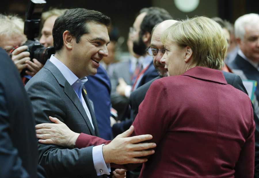 epa05676730 (L-R) Greek Prime Minister Alexis Tsipras, European Parliament President Martin Schulz and German Chancellor Angela Merkel chat prior to the start of an European Summit in Brussels, Belgium, 15 December 2016. EU leaders meet for a one-day summit which will mainly focus on the implementation of the EU-Turkey agreement on migration and the EU Internal Security Strategy. The 27 leaders are later the same day scheduled to meet informally for a dinner to discuss the Brexit process. EPA/OLIVIER HOSLET